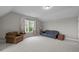 Bright and spacious bonus room with comfortable seating and great natural light at 821 Rambling Oaks Ln, Holly Springs, NC 27540