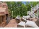 Inviting outdoor seating area with fireplace, perfect for relaxation and entertaining guests at 821 Rambling Oaks Ln, Holly Springs, NC 27540