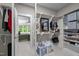 Well-organized walk-in closet connected to the main bedroom, offering ample storage space and convenience at 821 Rambling Oaks Ln, Holly Springs, NC 27540