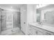 Bathroom with glass enclosed shower, double vanity, and modern fixtures at 8763 Wardle Ct, Wake Forest, NC 27587