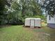 Backyard showing shed storage next to house at 902 Roanoke Ave, Henderson, NC 27536