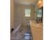 A bathroom with marble floors, and a marble vanity at 902 Roanoke Ave, Henderson, NC 27536