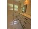 A bathroom with marble floors, and a marble vanity at 902 Roanoke Ave, Henderson, NC 27536