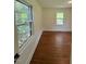 Bedroom featuring hardwood floors and natural light from the two windows at 902 Roanoke Ave, Henderson, NC 27536