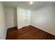 A bedroom with hardwood floors and white paneled walls at 902 Roanoke Ave, Henderson, NC 27536