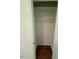 Walk-in closet with hardwood flooring and ample hanging storage space at 902 Roanoke Ave, Henderson, NC 27536