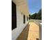 View from newly constructed deck to the freshly painted exterior at 902 Roanoke Ave, Henderson, NC 27536