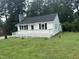 Charming home featuring a newly constructed deck and freshly painted exterior at 902 Roanoke Ave, Henderson, NC 27536