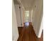 Long, newly refinished hallway with new paint at 902 Roanoke Ave, Henderson, NC 27536