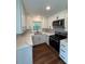 Stylish kitchen with new counters and white cabinets at 902 Roanoke Ave, Henderson, NC 27536