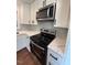 Renovated kitchen with modern appliances and cabinets at 902 Roanoke Ave, Henderson, NC 27536