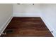 Utility room featuring hardwood floors and clean white baseboards at 902 Roanoke Ave, Henderson, NC 27536