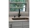 Modern matte black kitchen faucet and quartz countertops at 902 Roanoke Ave, Henderson, NC 27536