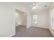 Comfortable bedroom with ceiling fan, neutral walls, and natural light at 929 Morreene Rd # C31, Durham, NC 27705