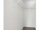 White walk-in closet with carpet and clothing racks at 929 Morreene Rd # C31, Durham, NC 27705