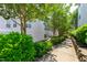Exterior angle of building with lush bushes and trees at 929 Morreene Rd # C31, Durham, NC 27705