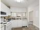 Efficient kitchen featuring white appliances and ample cabinet space for storage solutions at 929 Morreene Rd # C31, Durham, NC 27705