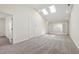 Bright living space featuring carpet, skylights, and easy access to additional rooms with natural light at 929 Morreene Rd # C31, Durham, NC 27705