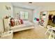 Bright bedroom with a study area, walk-in closet, and comfortable furniture at 9409 Collingdale Way, Raleigh, NC 27617