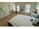 Bright bedroom with a study area, large windows, and a soccer ball themed bedspread at 9409 Collingdale Way, Raleigh, NC 27617