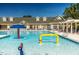 Inviting community pool with playful water features and ample lounge seating at 9409 Collingdale Way, Raleigh, NC 27617