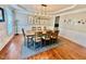 Dining room with modern chandelier and decor at 9409 Collingdale Way, Raleigh, NC 27617