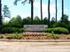 Brier Creek community entrance sign, set amidst colorful flowers, trees, and manicured landscaping at 9409 Collingdale Way, Raleigh, NC 27617