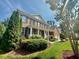 Beautiful brick home with manicured landscaping and a side-entry two-car garage at 9409 Collingdale Way, Raleigh, NC 27617
