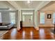 Bright foyer featuring hardwood floors and decorative columns at 9409 Collingdale Way, Raleigh, NC 27617