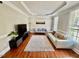 Cozy living room featuring a decorative trey ceiling and plush rug at 9409 Collingdale Way, Raleigh, NC 27617