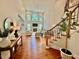 Sunlit living room features high ceilings, fireplace, with staircase leading to the second floor at 9409 Collingdale Way, Raleigh, NC 27617