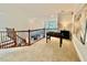 Loft area with foosball table overlooking the living room, creating a great entertainment space at 9409 Collingdale Way, Raleigh, NC 27617