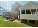Brick home featuring a beautiful outdoor patio with a screened-in porch and dining space at 9409 Collingdale Way, Raleigh, NC 27617