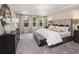 Serene bedroom boasting ample natural light, sophisticated decor, and comfortable furnishings, providing an inviting atmosphere at 1009 Red Roses Ave, Durham, NC 27703