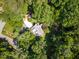 Aerial shot of a home nestled among lush, mature trees at 106 Wolfs Trl, Chapel Hill, NC 27516