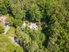 Overhead view of a secluded home nestled among lush greenery, offering privacy and tranquility at 106 Wolfs Trl, Chapel Hill, NC 27516