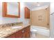Bright bathroom featuring a tub, walk in shower, and granite countertops at 106 Wolfs Trl, Chapel Hill, NC 27516