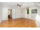 Spacious bedroom featuring hardwood floors and a ceiling fan at 106 Wolfs Trl, Chapel Hill, NC 27516