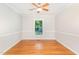 Cozy bedroom featuring hardwood floors and natural light at 106 Wolfs Trl, Chapel Hill, NC 27516