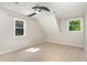 Bedroom with two windows, carpet, and ceiling fan at 106 Wolfs Trl, Chapel Hill, NC 27516