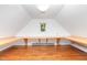 Bright attic bonus room featuring wood floors and a small window at 106 Wolfs Trl, Chapel Hill, NC 27516