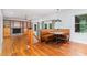 Bright dining area with booth seating and open floor plan to living room and fireplace at 106 Wolfs Trl, Chapel Hill, NC 27516