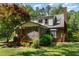 Charming home with a screened-in porch and mature landscaping at 106 Wolfs Trl, Chapel Hill, NC 27516