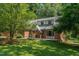 Charming brick home with mature trees and inviting front yard at 106 Wolfs Trl, Chapel Hill, NC 27516