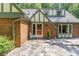 Inviting brick home entrance featuring stone patio at 106 Wolfs Trl, Chapel Hill, NC 27516