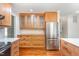 Updated kitchen featuring glass cabinets and stainless steel refrigerator at 106 Wolfs Trl, Chapel Hill, NC 27516