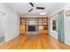 Open living room with fireplace, built-ins, and window seating at 106 Wolfs Trl, Chapel Hill, NC 27516