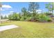 Spacious backyard with a concrete patio and lush greenery providing a serene outdoor space at 108 White Burley Ct, Durham, NC 27703