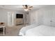 Primary bedroom features neutral walls, ceiling fan, double doors, and carpeted floors at 108 White Burley Ct, Durham, NC 27703