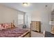 Bedroom featuring a bed, carpeted flooring, a dresser, two doors, and a window at 108 White Burley Ct, Durham, NC 27703
